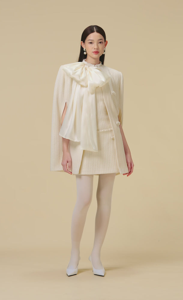 
            
                Load and play video in Gallery viewer, WHITE BEADED KNIT CAPE
            
        